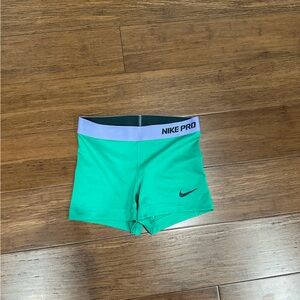Nike pros Size XS. Color: Green and Purple.